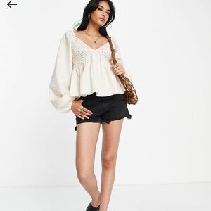 ASOS DESIGN v neck crochet top with frill sleeve and peplum hem in white